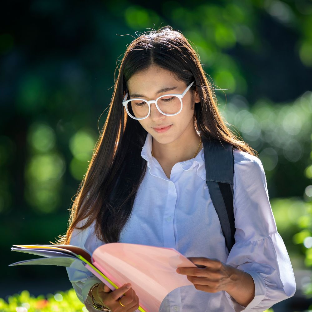 img of. a girl looking at school stuff